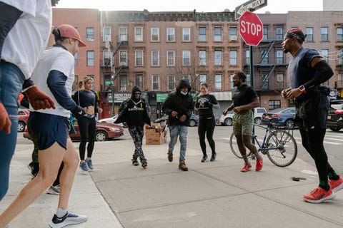 Rage and Release warming up in their neighborhood of Bed-Stuy with two local runners joining in on December 19 2021 rage and release stop for a group photo left to right, top to bottom saoni fortuna, daniela hernandez, tammy salazar andurand, thai richards, reph , joshua pierre, andrew pelliccia, lauren kaczmarek, isaiah joao dasilva schmitt