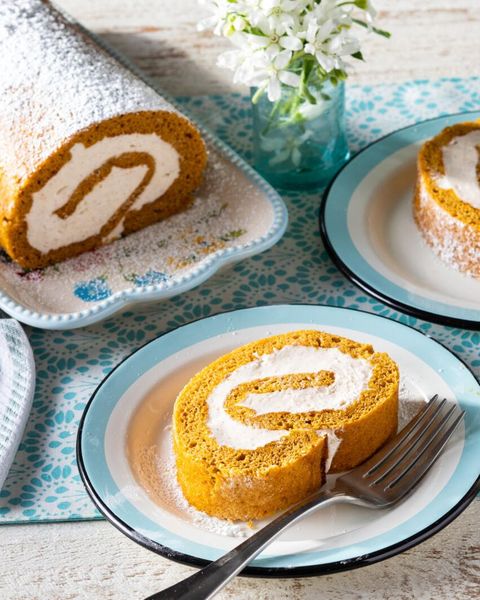 thanksgiving cakes pumpkin roll cake with slice on plate