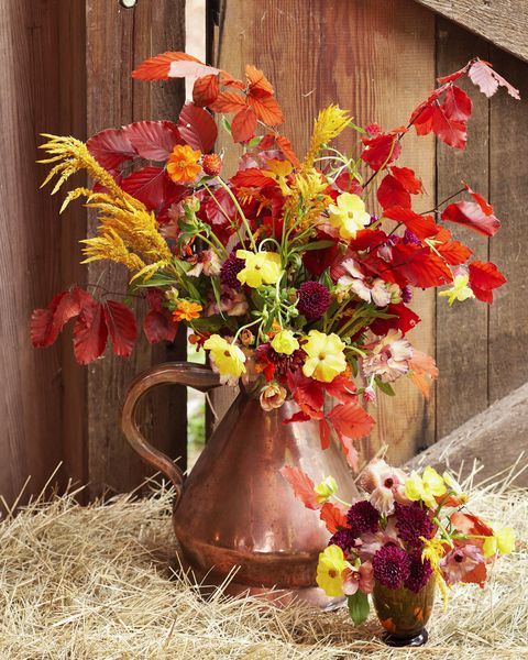seasonal flower bouquet arrangement in a copper pitcher