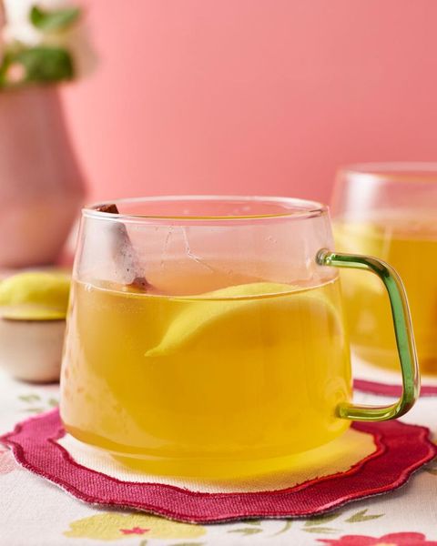 hot toddy in glass mug with lemon