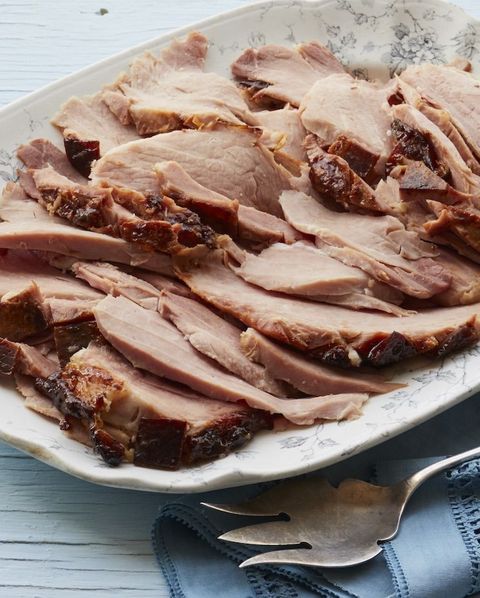 root beer glazed ham sliced on a platter