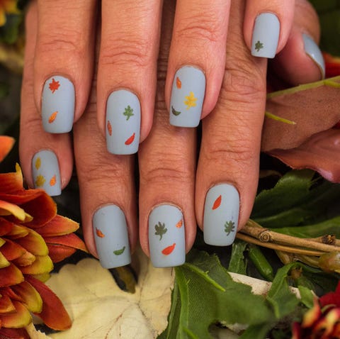 thanksgiving nails falling leaves grayish blue painted nails with falling leaves in all colors scattered about