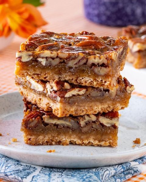 pecan pie bars stacked on plate