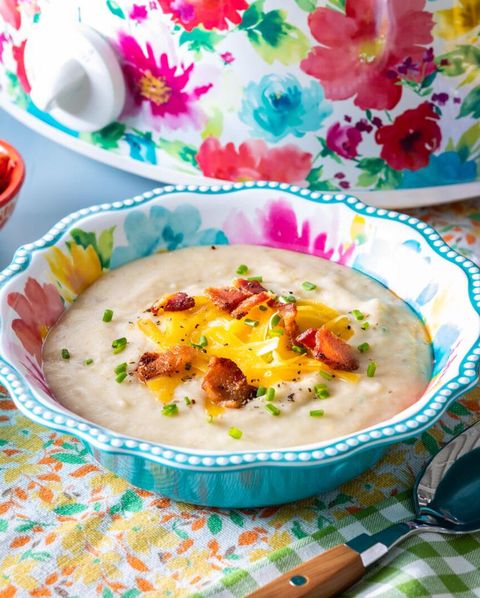 slow cooker potato soup with floral slow cooker in back
