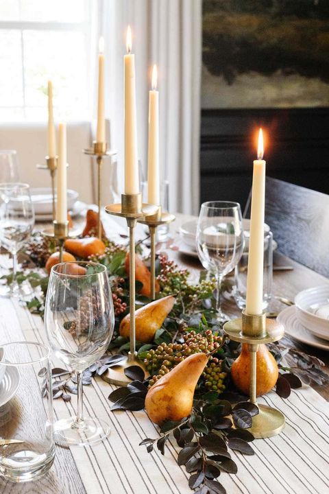 thanksgiving table setting with pears and gold candlesticks
