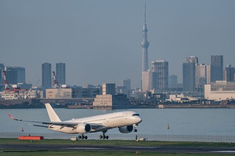 the airplane landing at the airport in tokyo of japan