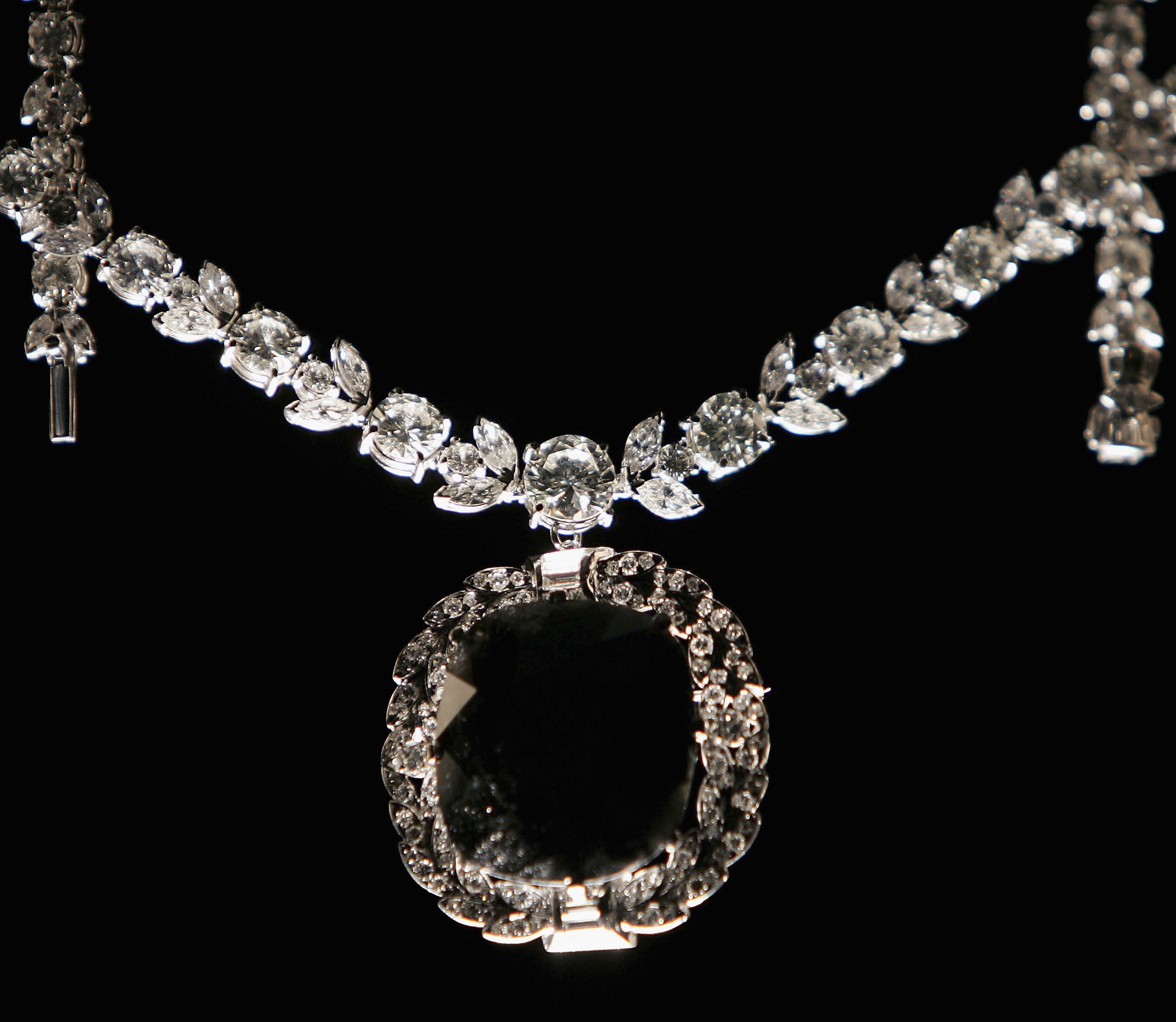 the-black-orlov-diamond-is-displayed-by-its-handler-during-news-photo-1588798967.jpg