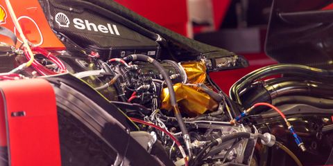 The engine of the Ferrari Sf90 in the pits during previews...
