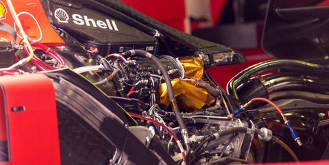 the engine of the ferrari sf90 in the pits during previews