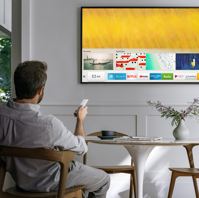 samsung the frame tv in room with man and modern breakfast table