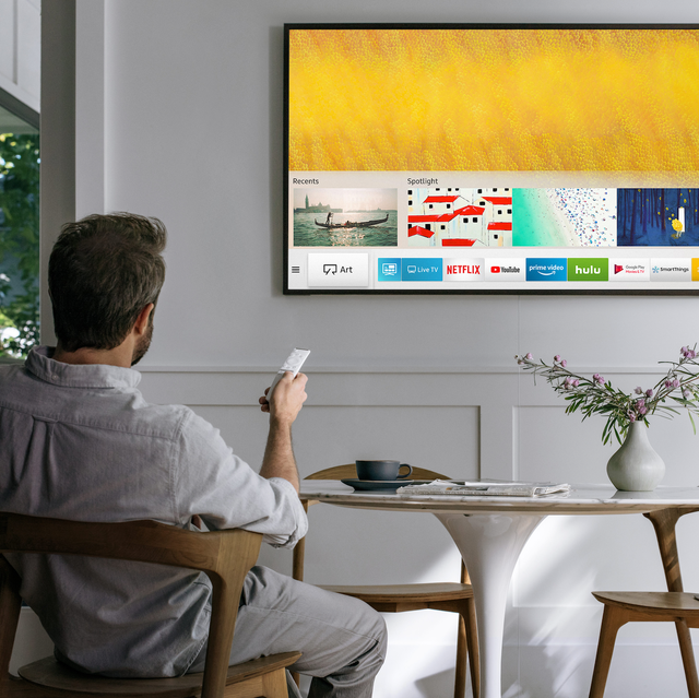 Samsung The Frame TV in room with man and modern breakfast table samsung the frame tv in room with man and modern breakfast table