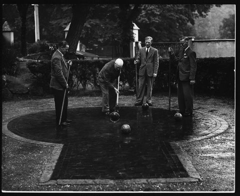 Men playing a game in Pall Mall in Hampstead 1951