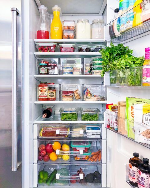 a refrigerator divided into zones of food