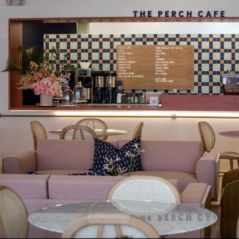 coffee bar with terrazzo tables and pink and blue tiled backsplash
