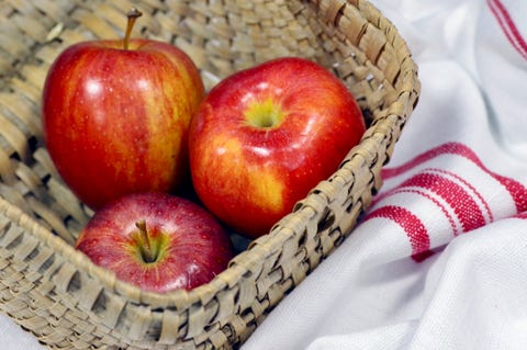 Theee Red Apples in a Picnic Basket Theee Red Apples in a Picnic Basket