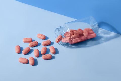 hiv therapy pills on pink background