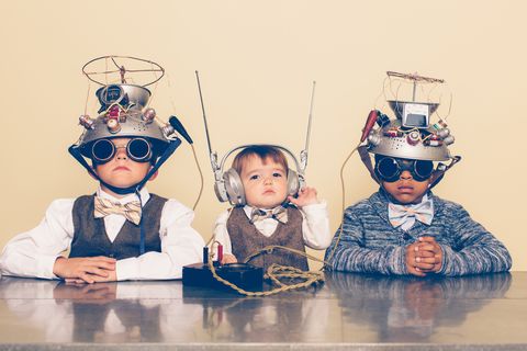 three boys dressed as nerds with mind reading helmets