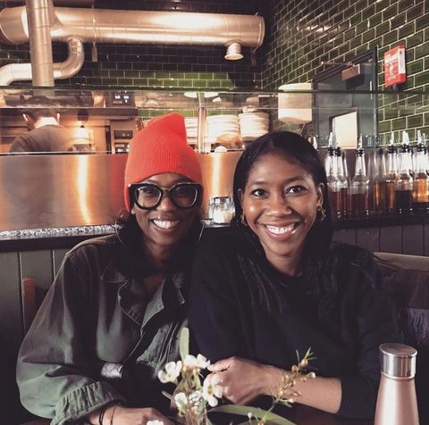 author kenya hunt with her friend kathleen hyppolite at a restaurant
