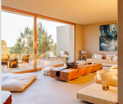 a naturally fallen brazilian wood coffee table is the focus in this comfortable living area at melides art resort in portugal