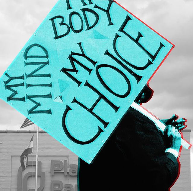 pro choice protestor carrying a sign that reads "my mind, my body, my choice" outside a planned parenthood
