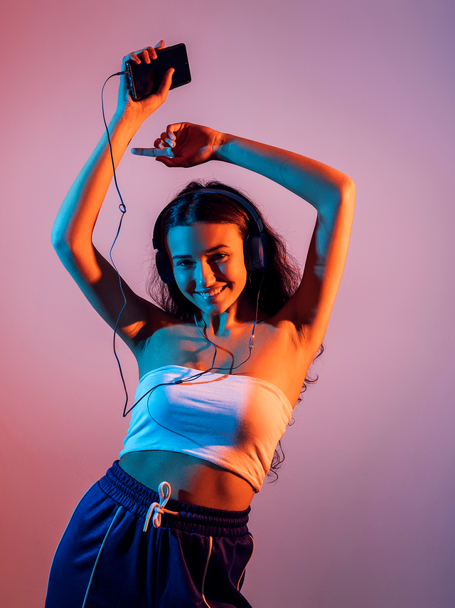 girl dancing with headphones