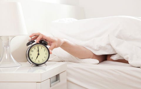 Pressing snooze on alarm clock Pressing snooze on alarm clock