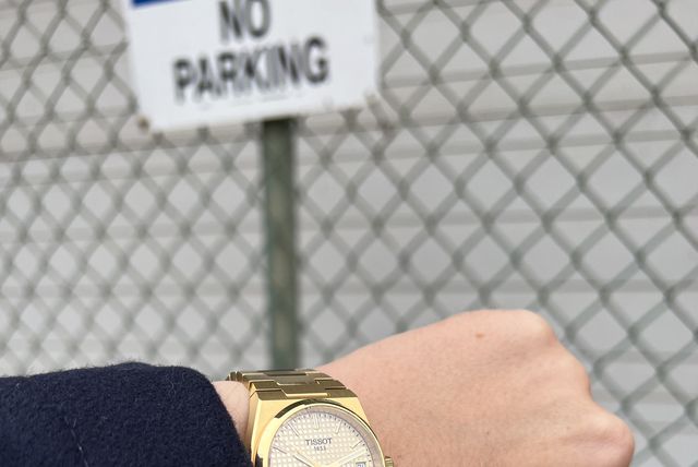 a person holding a watch