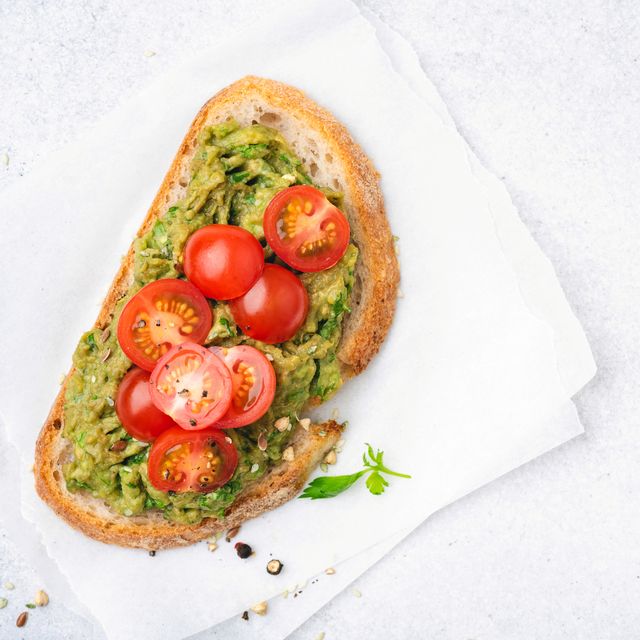 toast with mashed avocado and cherry tomatoes