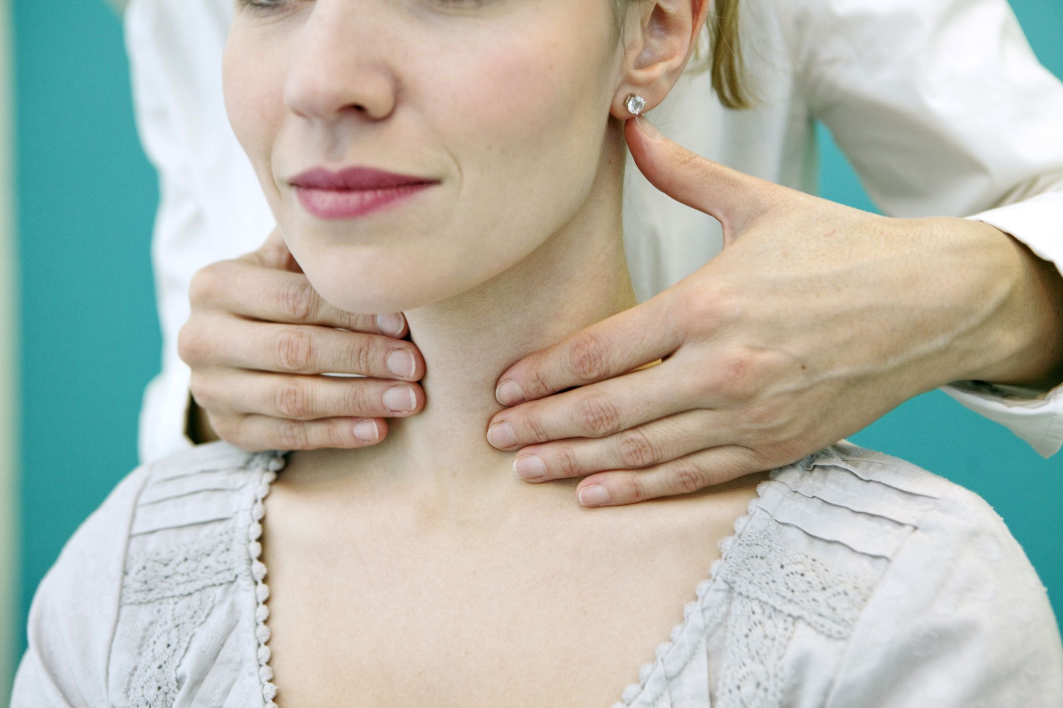 swollen tonsils with white spots and swollen glands