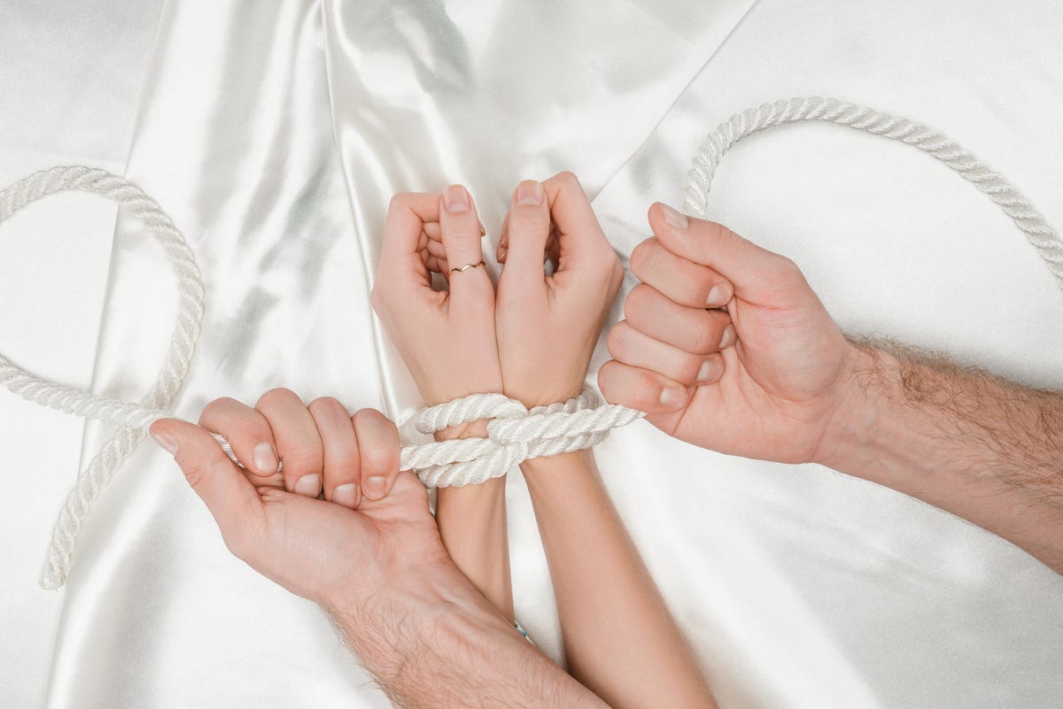 What to do to a tied up man