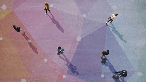 top view of people walking in different directions of pattern, painted on asphalt