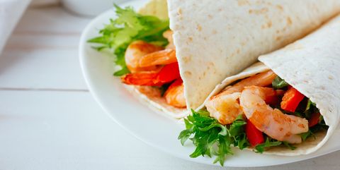 Tortilla with shrimps and salad