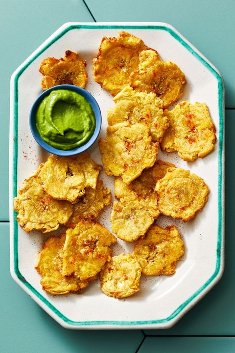 air fryer tostones with cilantro dip on turquoise tile background