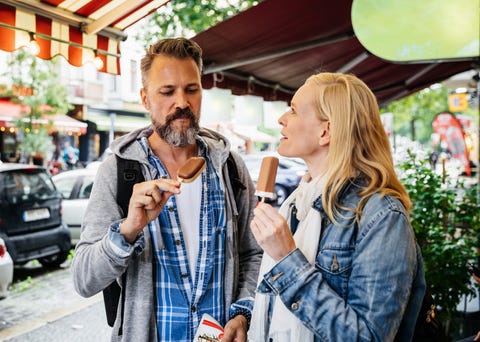 Tourist Couple Eating Ice Cream Together