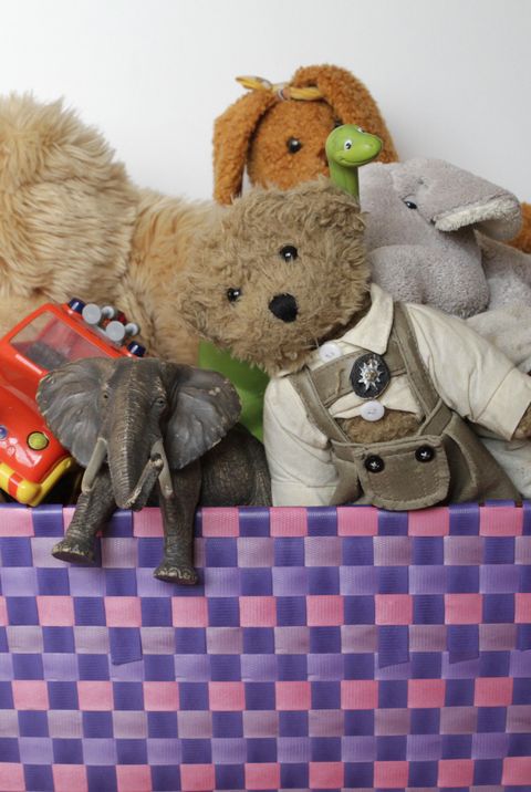 toy organization tips toy box overflowing with stuffed animals and toys