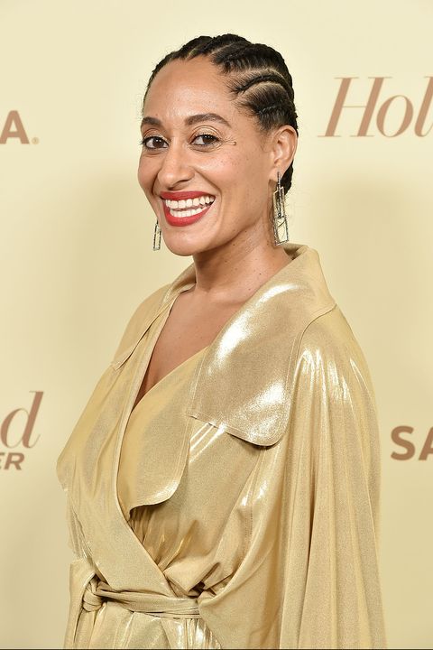 tracee ellis ross has a gold shimmery top and a braided bun which is a great short black hairstyle idea