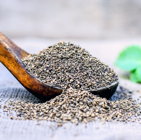 trachyspermum ammi ajwain seeds in a wooden scoop royalty free image