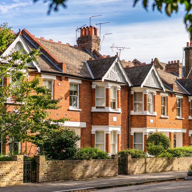 a street of traditional terraced houses, on a quiet leafy street in east london