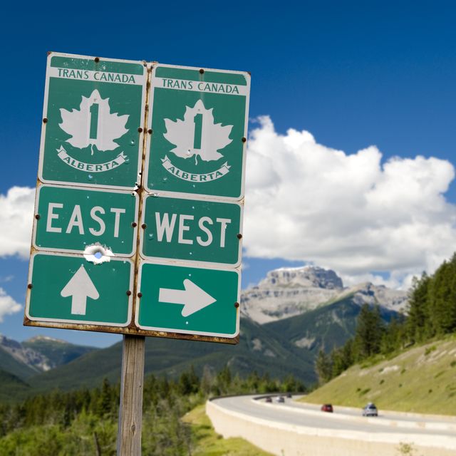trans canada highway with roadsign through the rocky mountains