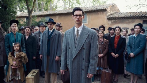 cory michael smith as varian fry , amit rahav as thomas lovegrove and other cast members in transatlantic, courtesy of netflix © 2023