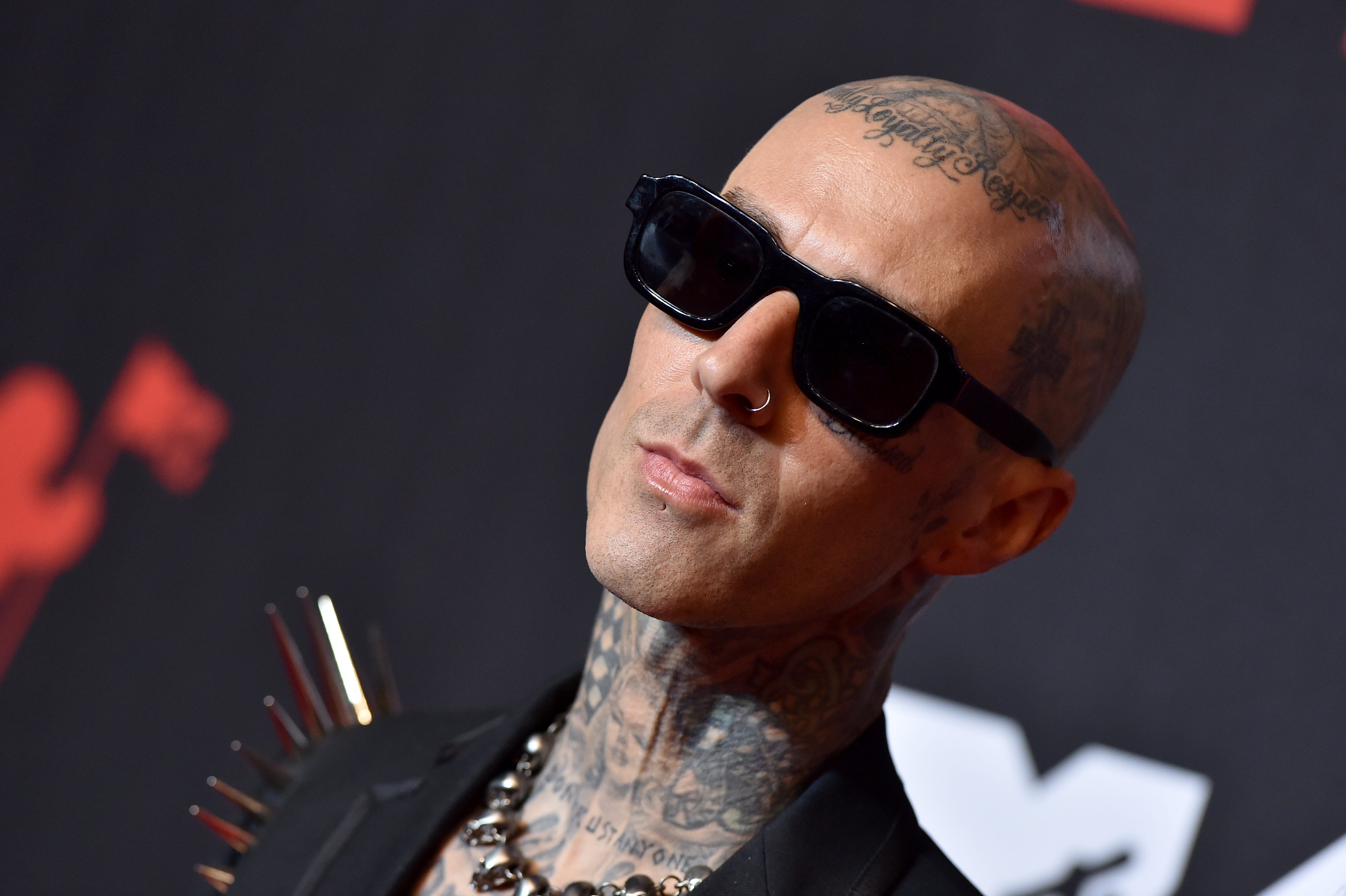 Watch Travis Barker Get a Tattoo in the Middle of a Dentist Appointment