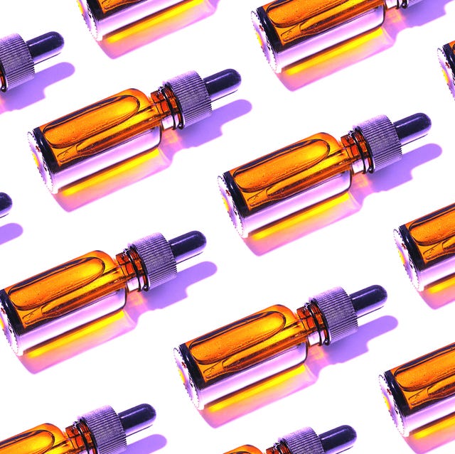 Trendy Pattern made of Beauty product Facial Serums or Natural Essential Oil in cosmetic bottle with dropper and bright shadow on white background. trendy pattern made of beauty product facial serums or natural essential oil in cosmetic bottle with dropper and bright shadow on white background
