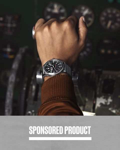 sponsored product man with hand on control of airplane wearing luminox watch