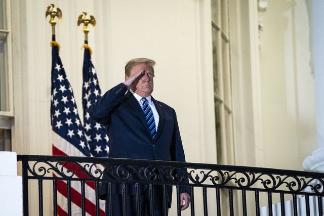 washington, dc   october 5 president donald j trump salutes to marine one from the truman balcony as he returns home after receiving treatments for the covid 19 coronavirus at walter reed national military medical center, at the white house on monday, oct 05, 2020 in washington, dc photo by jabin botsfordthe washington post via getty images
