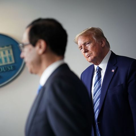 us president donald trump r watches as treasury secretary steven mnuchin speaks during the daily briefing on the novel coronavirus, which causes covid 19, in the brady briefing room of the white house in washington, dc on april 21, 2020 photo by mandel ngan  afp photo by mandel nganafp via getty images
