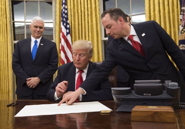 washington, dc   january 20   president donald trump prepares to sign a confirmation for defense secretary james mattis as his chief of staff reince priebus l points to the order while vice president mike pence watches january 20, 2017 in washington, dc  photo by kevin dietsch   poolgetty images