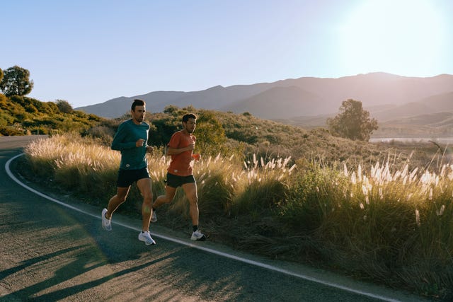 two men running in san diego in tracksmith shorts