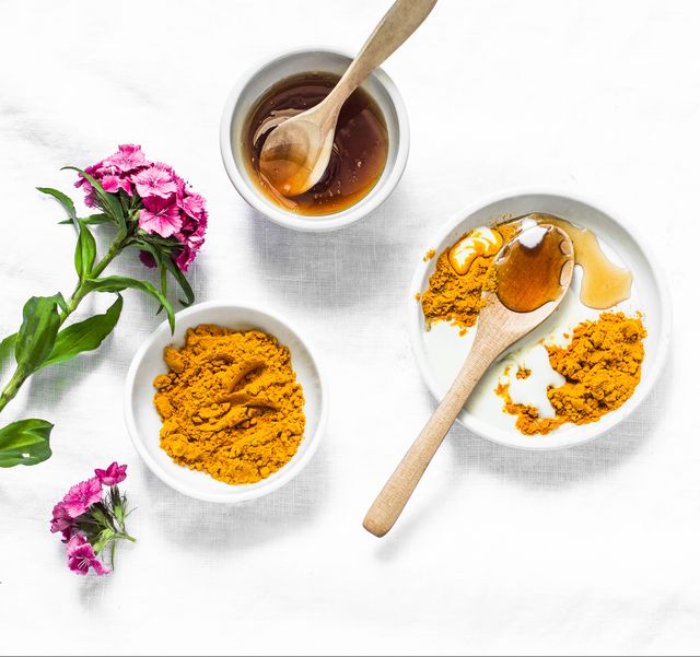 turmeric, honey, coconut milk face mask homemade ingredients beauty products on a light background, top view beauty, skin care concept