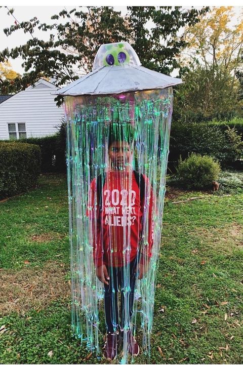 ufo halloween costume for tweens that looks like child is being beamed up by an alien spacecraft