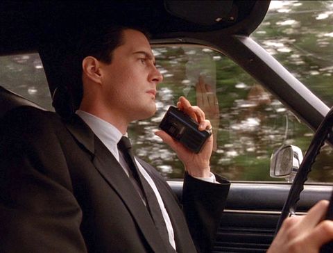 american actor kyle maclachlan as special agent dale cooper holds a portable cassette recorder as he drives a car in a scene from the pilot episode of the television series twin peaks, originally broadcast on april 8, 1990 photo by cbs photo archivegetty images